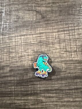 Dutch Bros T-Rex with rollerskates and a drink shoe charm